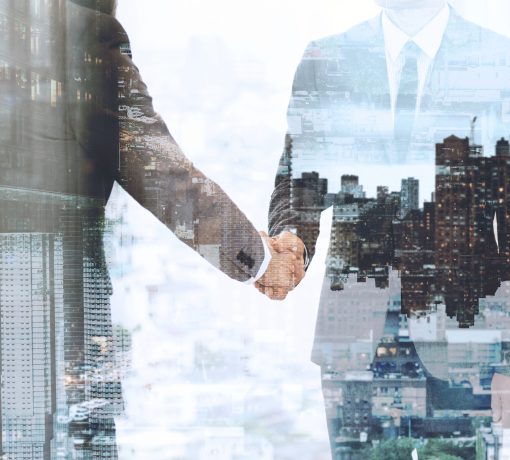 Corporate business handshake between business partners Corporate business handshake between business partners