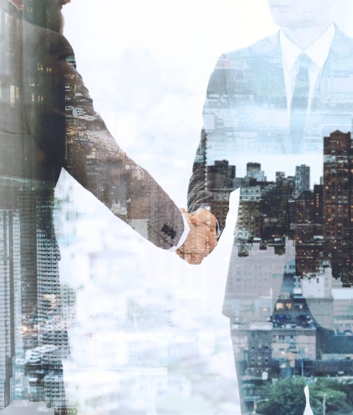 Corporate business handshake between business partners Corporate business handshake between business partners